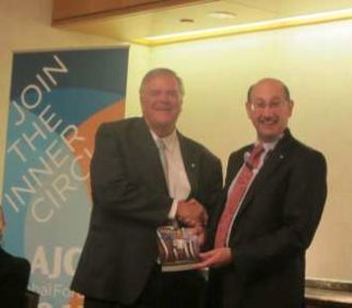 Jeremy Jones AM giving the Cooper book to the Australian Ambassador to USA Kim Beazley June 13