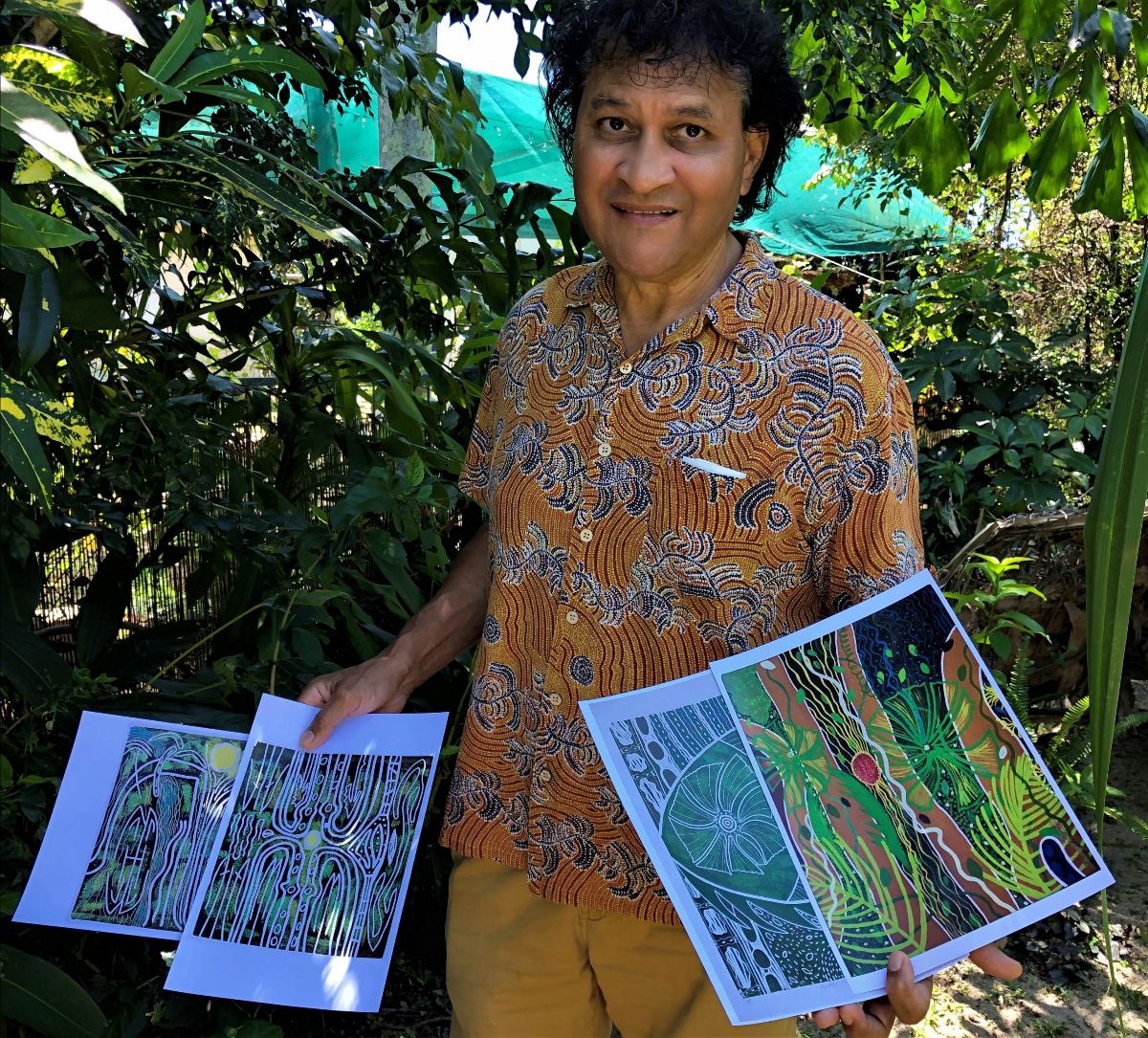 Munganbana Norman Miller in tropical garden with Rainforest prints